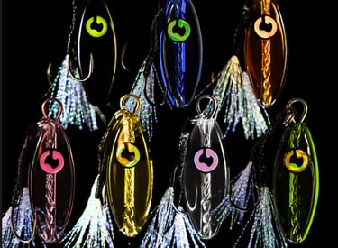 Assorted colorful glass fishing lures designed and made in australia .