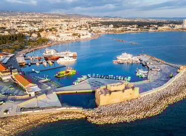Aerial view of Paphos Harbour and the medieval Paphos Castle on the Mediterranean coast of Cyprus.