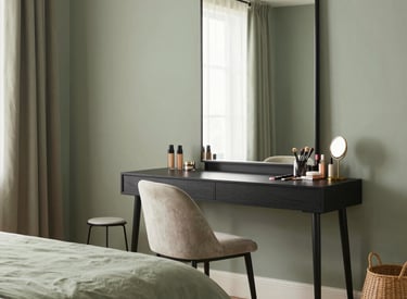 A cozy living room with soft lighting, plush seating, and warm wooden accents.