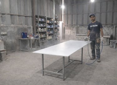 a man in a black shirt and a white table