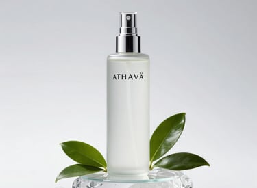 A minimalist black and gold perfume bottle standing tall against a crisp white background, reflecting timeless luxury.