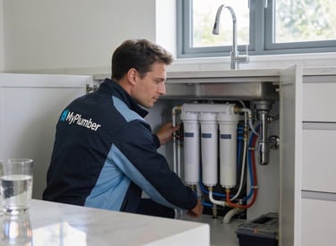 Professional plumber in Glasgow installing premium under sink water filtration system