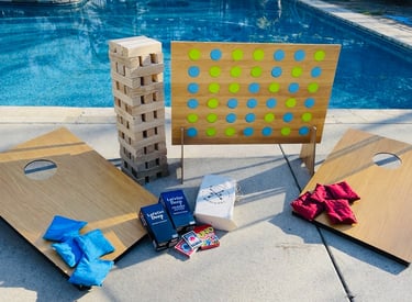 Games Package from Gathered Grace Picnic Co. Jumbo connect four, giant jenga, cornhole, cards