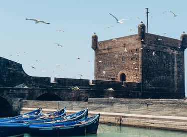 Essaouira ramparts and fishing boats during 4-day coastal heritage tour