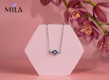 a necklace with a evil eye on it