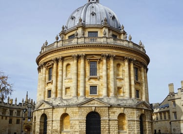 A group of Indian students celebrating their university acceptance letters outdoors.