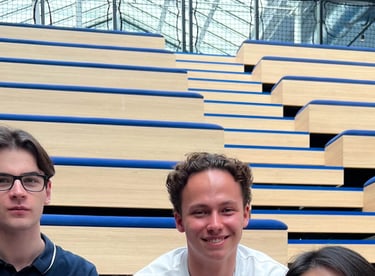 a group of people sitting on a bench in a school