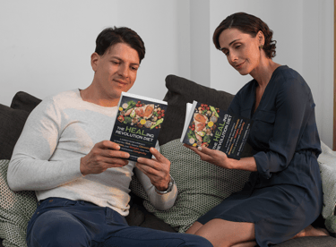 couple reading Healing Revolution Diet