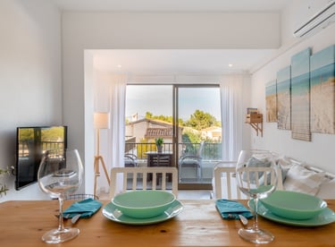 a dining table with a table setting for two