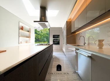 a kitchen with a long counter top and a large window