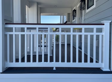 Vinyl patriot railing with mahogany woodgrain vinyl wrapped top