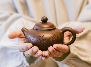 Holding a teapot in hands