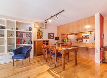 a dining room with a table and chairs
