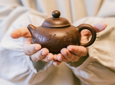 Holding a teapot in hands