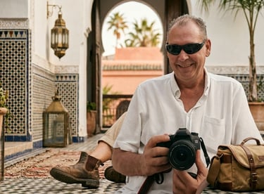 Professional commercial photographer holding a high-end digital camera during an on-location editori
