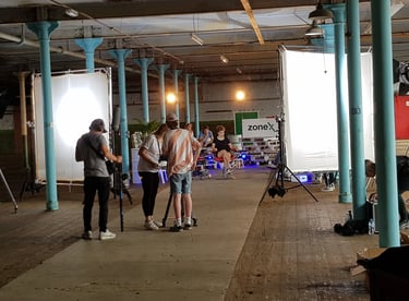 Film production crew creating content in the main room at Atlas Studios