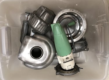 Metal parts in a sculptor's workshop bin, image 10.