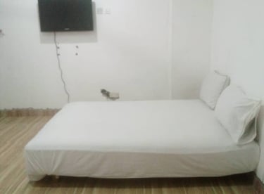 Affordable Bedroom at Denco Lodge Nungua, in Ghan fully equipped with flat screen and other accessor