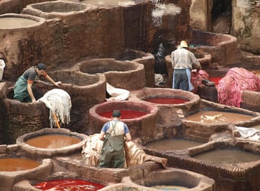 a group of people working in a tannery