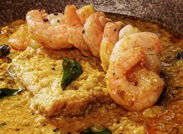 a bowl of food with shrimp and vegetables