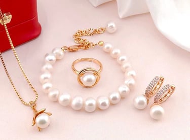 a jewelry set with pearls and a necklace