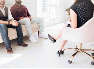 2 men seated together in an office