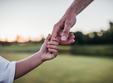 father and son holding hands