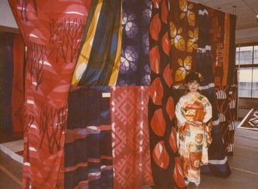 Kayoko, dressed in a kimono with her fabric work.