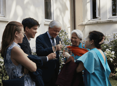 a group of people standing around a group of people