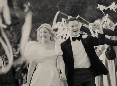 a bride and groom walking down a path with confettirs