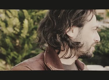 a man with long hair and a beard
