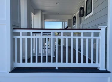 Vinyl patriot railing with mahogany woodgrain vinyl wrapped top