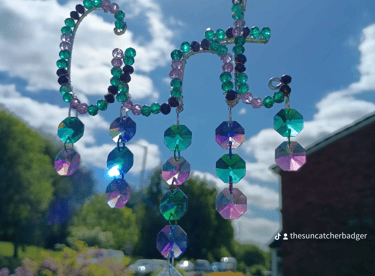 A deep ocean inspired cunt suncatcher called The Sea Witch