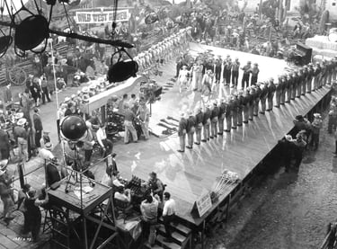 Berkeley and crew filming Judy Garland and Mickey Rooney’s “I Got Rhythm” with cowboy dancers.