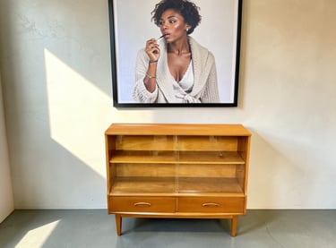 Jentique Mid Century teak cabinet with retro vintage design and practical storage for living room, bedroom, or hallway.