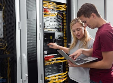 Network engineers, working on the cabinet