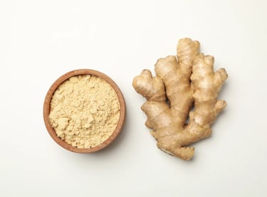 Ginger and bowl with ginger powder on white background