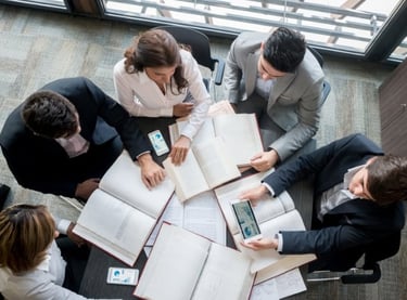Team analyzing market trends and product positioning strategies – Zyncopra trade support