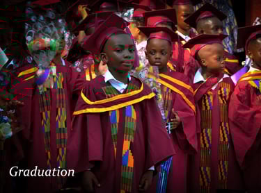 a group of young children in graduation gowns