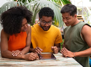 a group of people standing around a table make the interactive