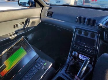 a car driving down a highway with a laptop computer