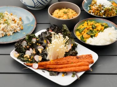 a table with bowls of vegetarian food 