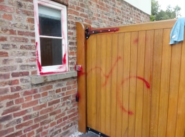 gate with graffiti