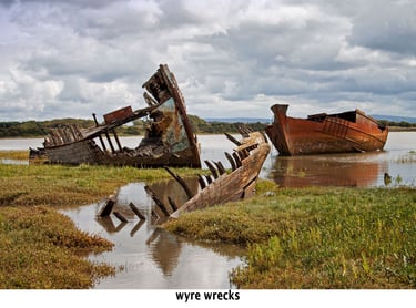 wrecks surrounded by water at high tide on the river wyre