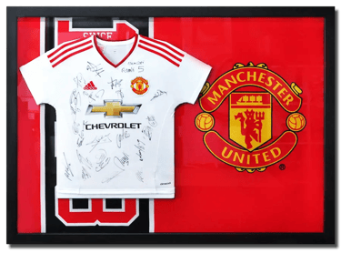 A Manchester United jersey framed together with MU's flag
