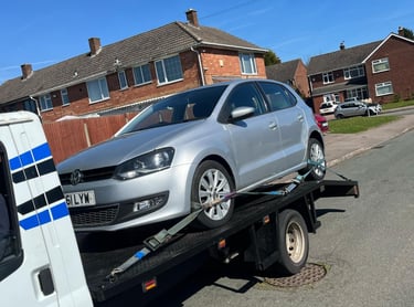 alt="End-of-life vehicle being removed in Worcester city centre"