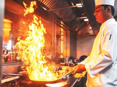 Culinary arts student preparing gourmet dish in professional kitchen