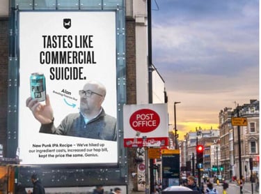 BrewDog billboard reading “Tastes like commercial suicide,” showing a man holding a can of Punk IPA on a city street.