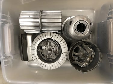 Metal parts in a sculptor's workshop bin, image 14.