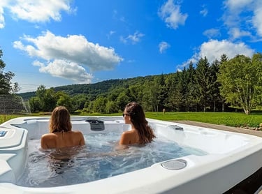 Soak in serenity with this private hot tub overlooking the stunning Catskill Mountains.